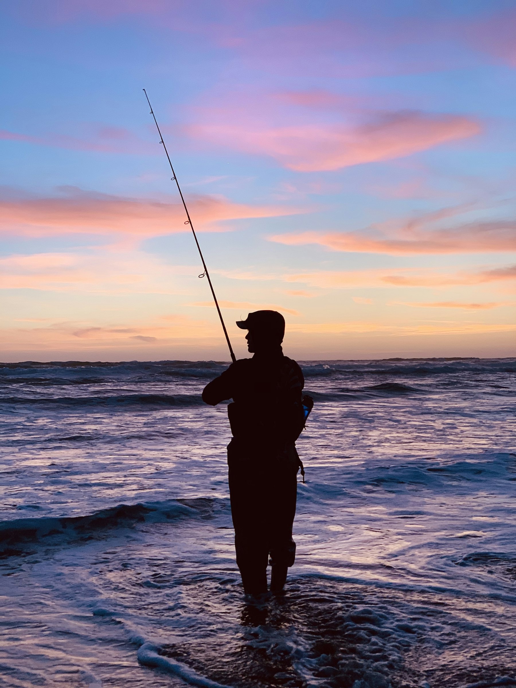a coast / angler-at-dawn photo